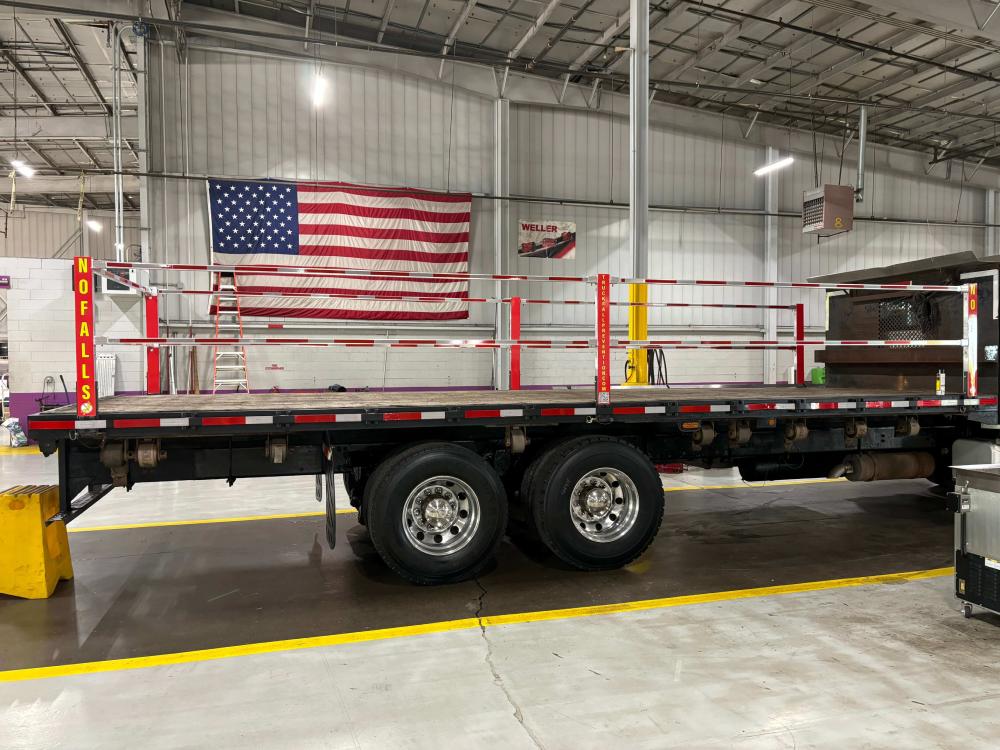A Truck Fall Prevention Aluminum Bar System on a flatbed truck similar to what Steel Dynamics uses.
